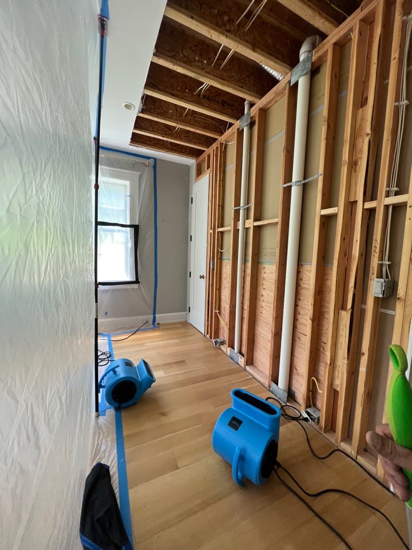 Water-damaged wall opened and dried in a Litchfield, CT home, then restored, before