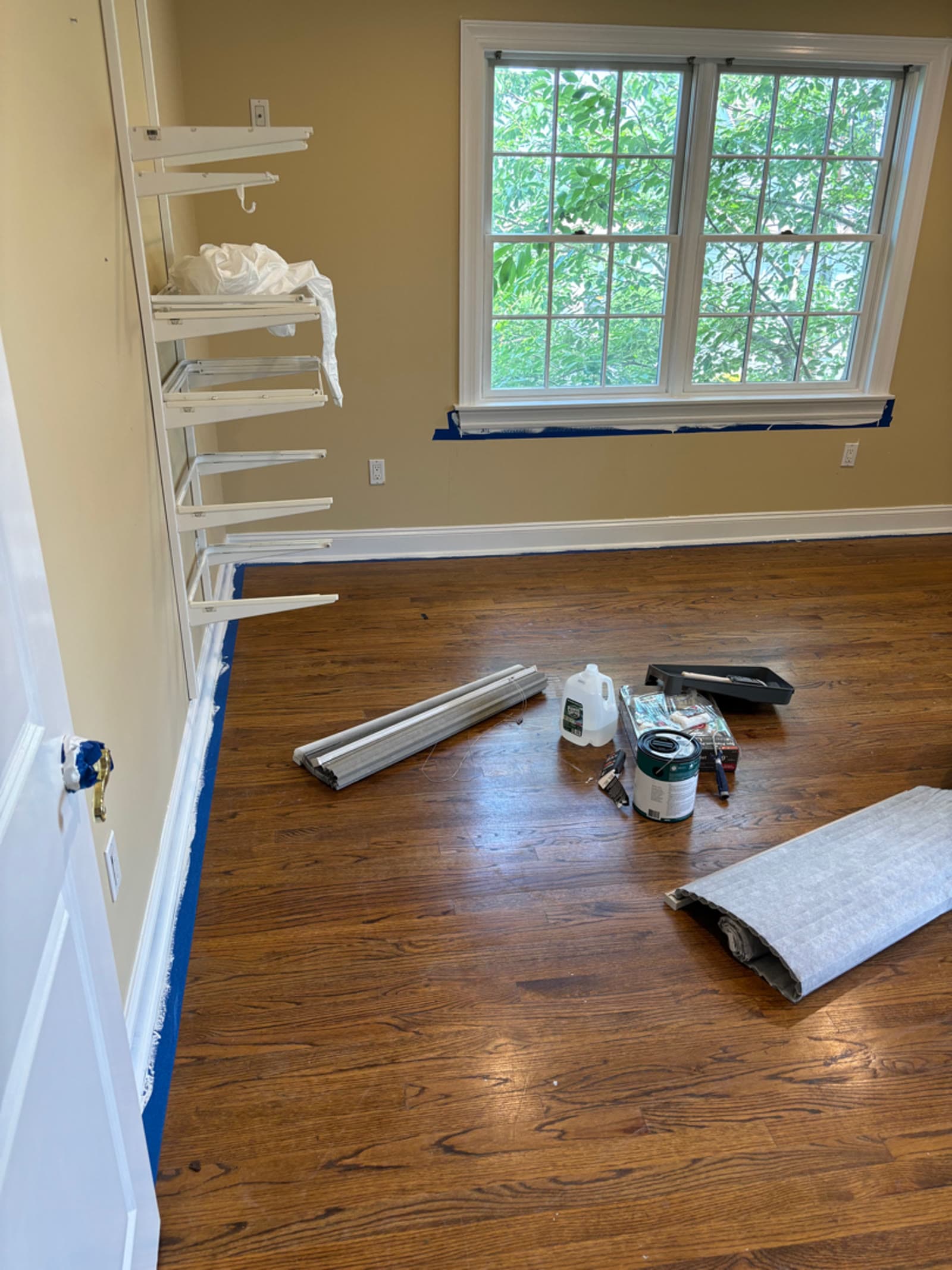 Bedroom mid reconstruction with fresh drywall, trim and bare hardwood in a Mamaroneck, NY home