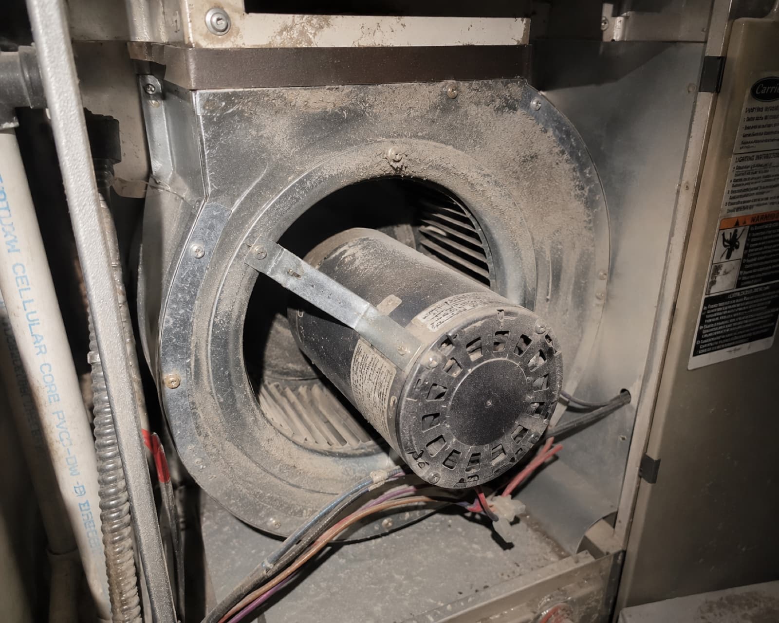 Blower housing and motor area packed with dust that recirculates through the home, before cleaning the housing and motor area