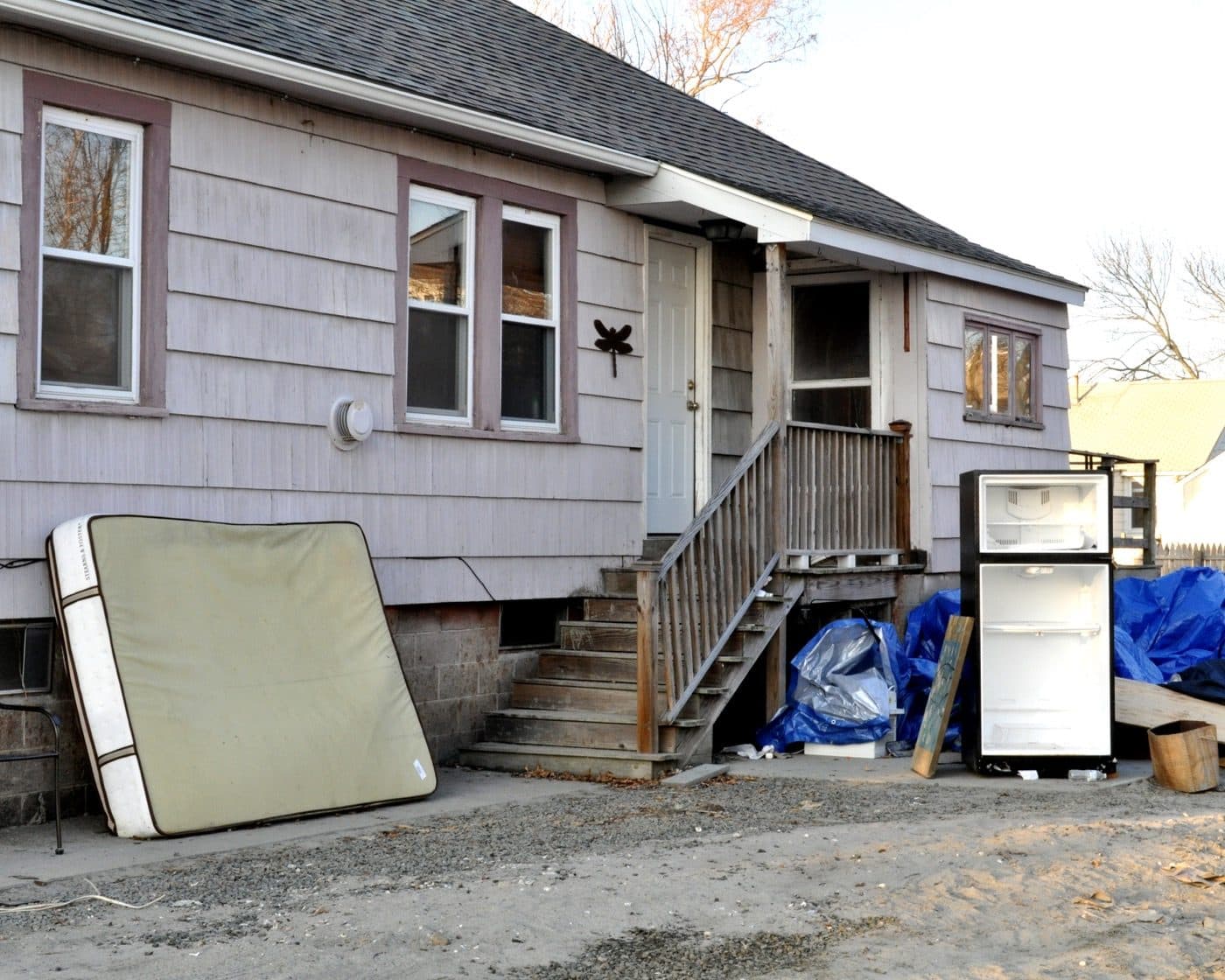 A Hudson River shoreline neighborhood flooded after a major tropical-remnant storm, a representative regional photo of the inland and riverine flood threat in lower New York.