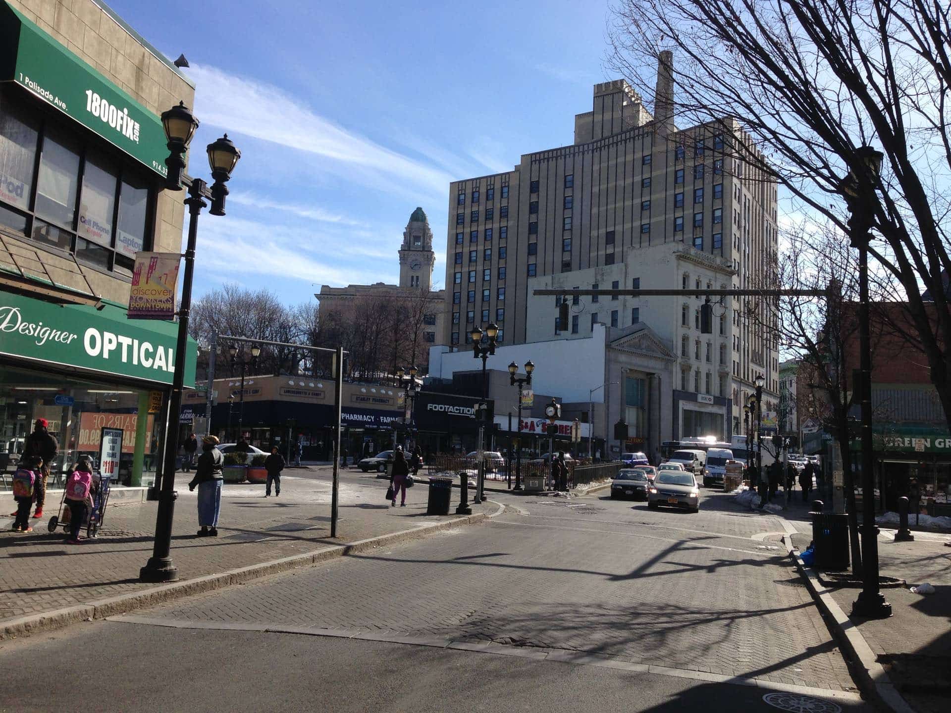 Downtown Yonkers, New York at Getty Square with the City Hall clock tower. Green Restoration provides 24/7 water, fire, mold, and storm damage restoration in Yonkers, NY.